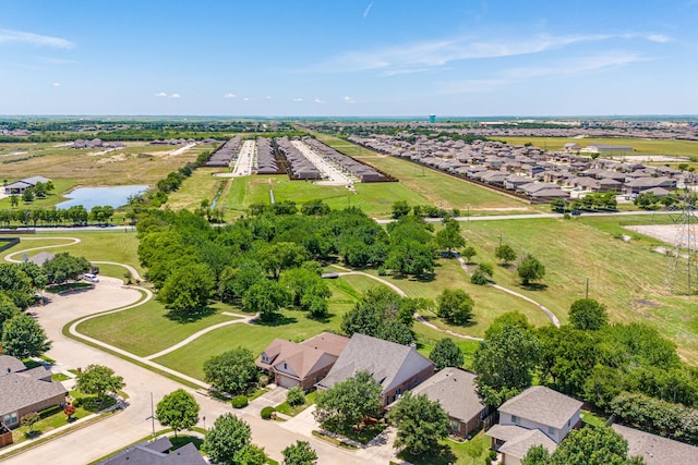 drone / aerial view with a water view and a residential view