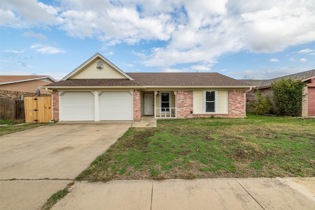 ranch-style house with brick siding, concrete driveway, an attached garage, fence, and a front yard