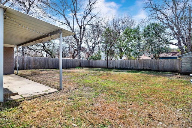 view of yard with a fenced backyard