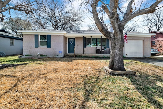 single story home featuring a garage, covered porch, brick siding, concrete driveway, and a front lawn