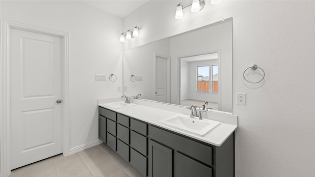 full bathroom featuring tile patterned floors, a sink, and double vanity