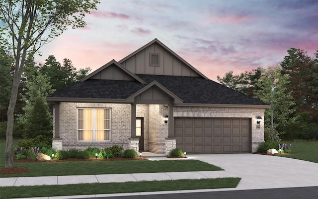 view of front of house featuring brick siding, a yard, concrete driveway, an attached garage, and board and batten siding