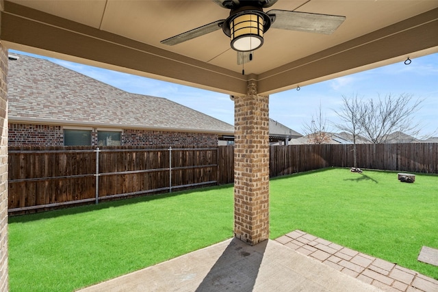 view of yard with ceiling fan, a patio, and a fenced backyard