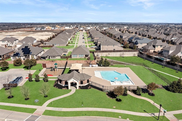 birds eye view of property with a residential view