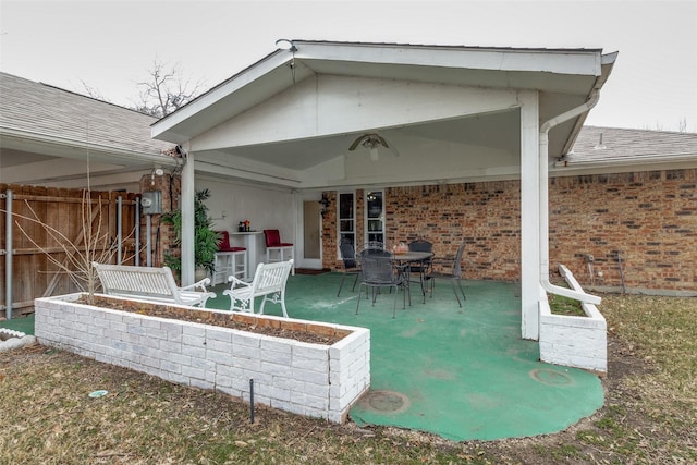 view of patio / terrace featuring fence