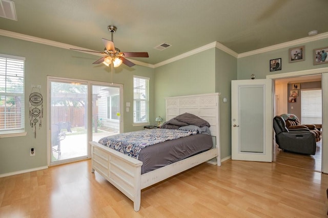 bedroom featuring access to outside, light wood-type flooring, and visible vents