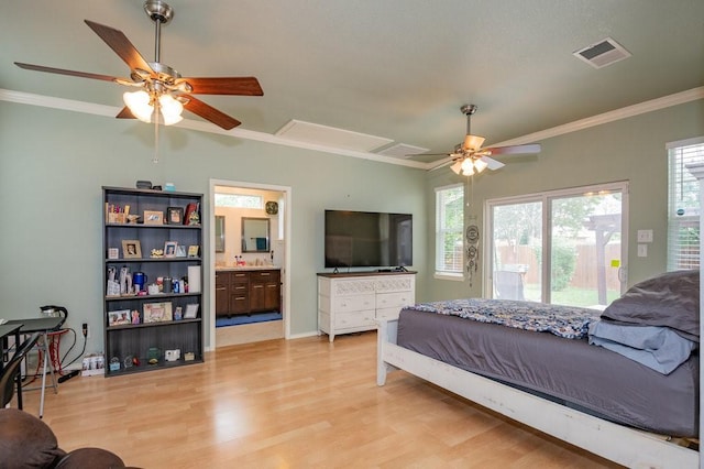 bedroom featuring crown molding, light wood finished floors, visible vents, and access to exterior