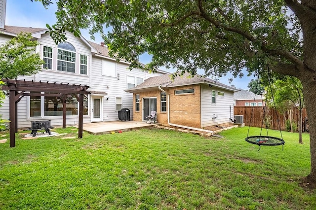 back of house featuring brick siding, a patio, central AC, fence, and a pergola