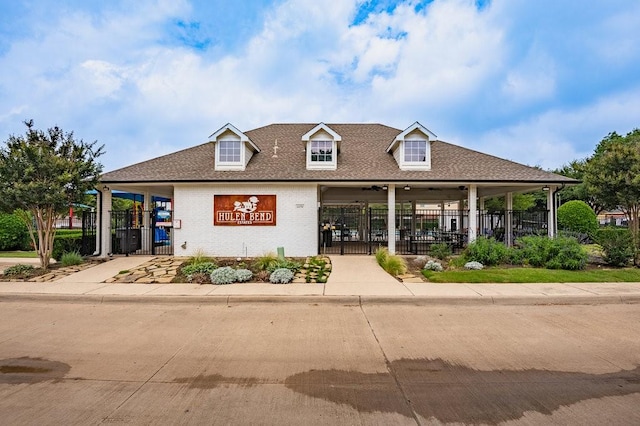 view of property with a carport and fence