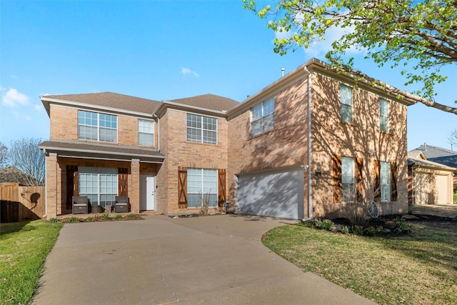 6500 High Brook Dr, Fort Worth, TX 76132 - view of front facade featuring concrete driveway, fence, an attached garage, a front yard, and brick siding