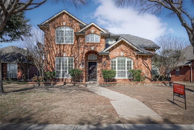 traditional home with brick siding