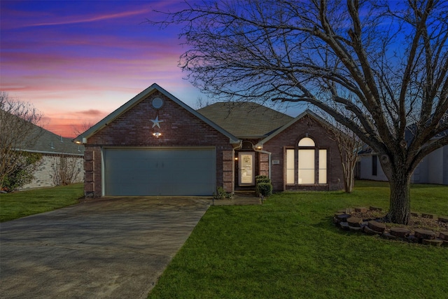 view of front facade featuring a garage, concrete driveway, brick siding, and a front lawn