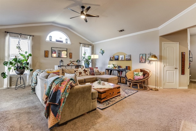 living room featuring lofted ceiling, ceiling fan, visible vents, ornamental molding, and carpet