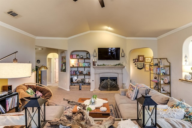 carpeted living area with arched walkways, a fireplace, lofted ceiling, visible vents, and ornamental molding