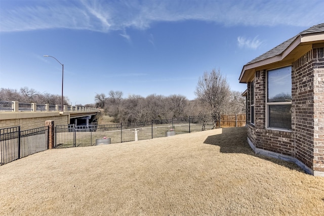 view of yard featuring fence