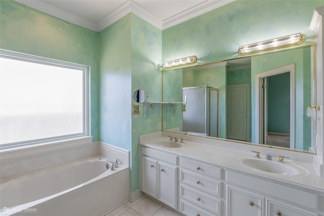 full bath with a garden tub, double vanity, ornamental molding, a sink, and tile patterned flooring