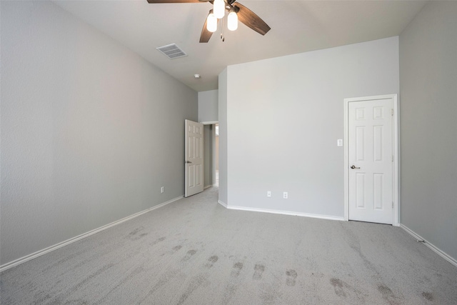 unfurnished bedroom featuring carpet, visible vents, and baseboards