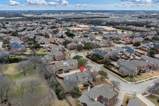 birds eye view of property with a residential view