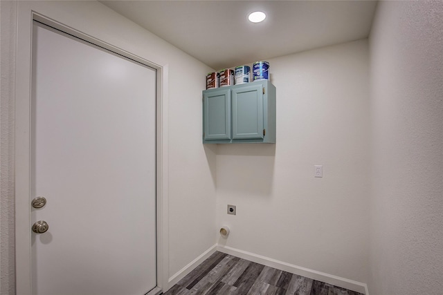 laundry room with cabinet space, baseboards, dark wood-type flooring, and hookup for an electric dryer