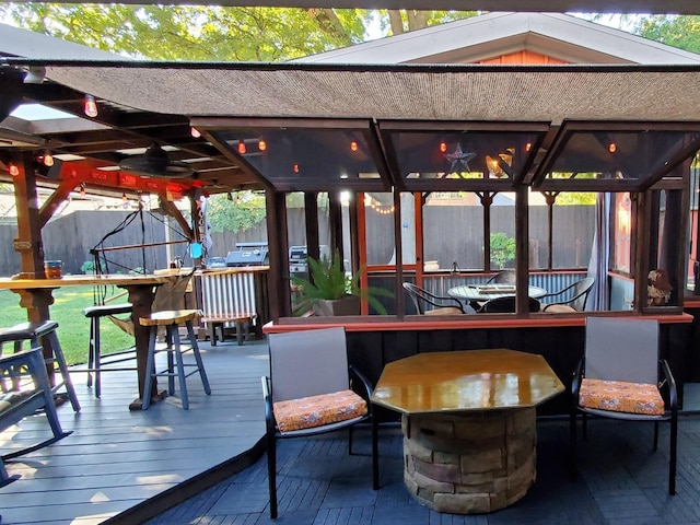 deck featuring fence and a gazebo