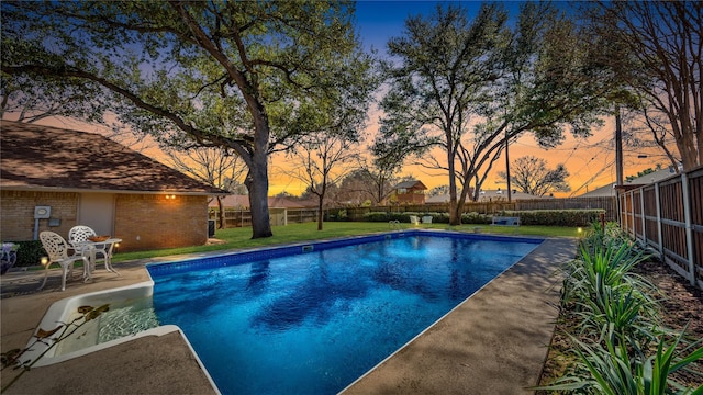 view of pool with a patio, a yard, a fenced backyard, and a fenced in pool