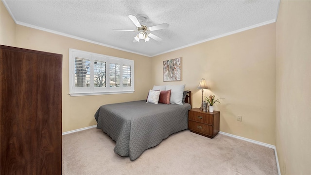 bedroom with baseboards, crown molding, and light colored carpet