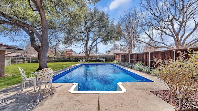 view of swimming pool with a fenced backyard, a patio, and a lawn