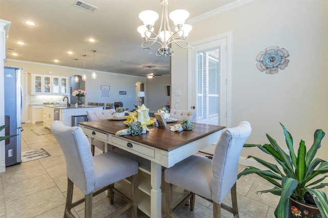 dining area featuring light tile patterned floors, recessed lighting, visible vents, ornamental molding, and a chandelier