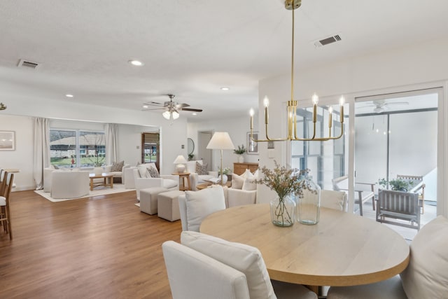 dining area featuring recessed lighting, visible vents, ceiling fan, and wood finished floors