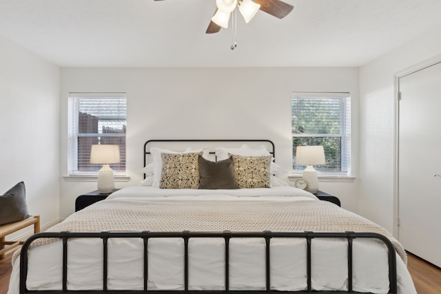 bedroom with ceiling fan and wood finished floors