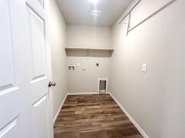 clothes washing area with washer hookup, hookup for an electric dryer, gas dryer hookup, wood finished floors, and laundry area