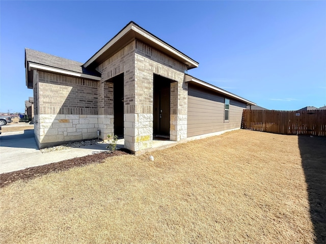 view of outdoor structure featuring fence