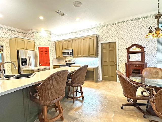 kitchen with crown molding, appliances with stainless steel finishes, visible vents, and wallpapered walls