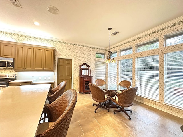 dining room featuring wallpapered walls, visible vents, and ornamental molding