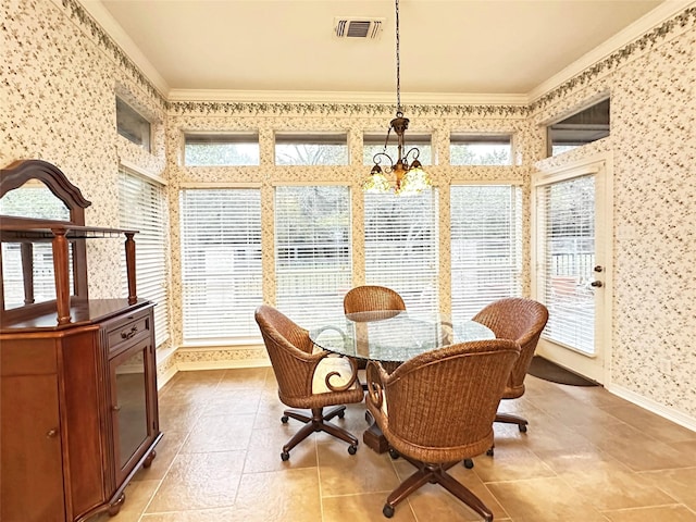 sunroom with a chandelier and visible vents