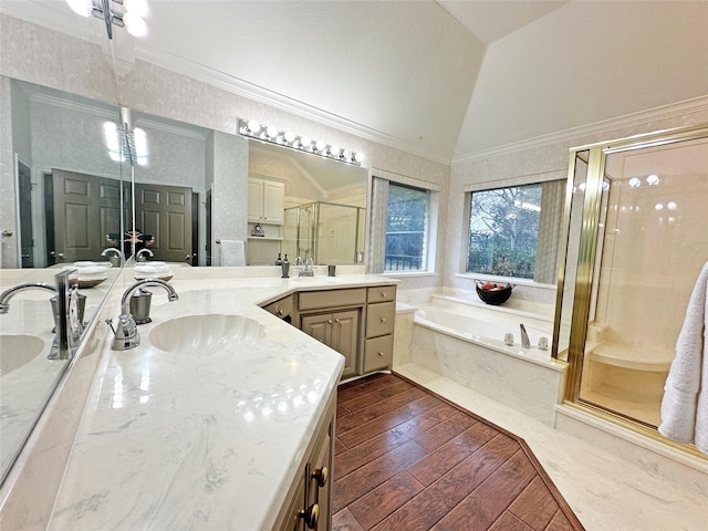 full bath featuring hardwood / wood-style flooring, lofted ceiling, ornamental molding, a shower stall, and a bath