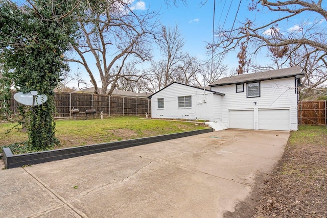 9723 Queenswood Ln, Dallas, TX 75238 - exterior space featuring a garage, a lawn, concrete driveway, and fence