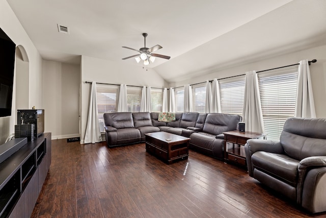 living area with baseboards, visible vents, a ceiling fan, lofted ceiling, and dark wood-type flooring