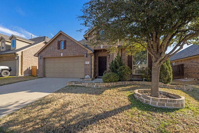 view of front of house featuring driveway, a garage, and brick siding