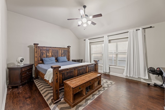 bedroom with lofted ceiling, dark wood-type flooring, a ceiling fan, and baseboards