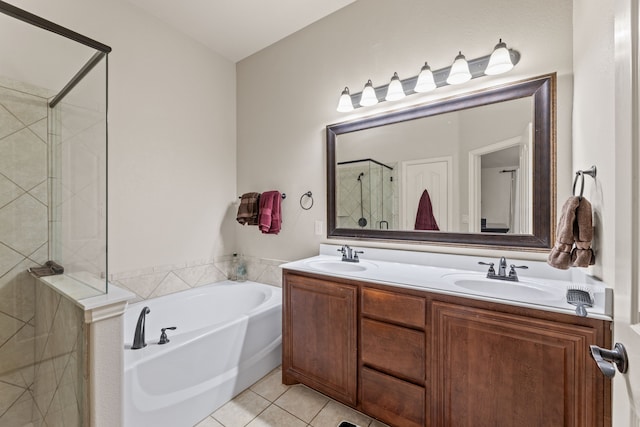 full bath with tile patterned flooring, a shower with shower door, a sink, and a bath