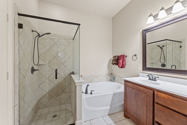 full bathroom featuring a shower stall, vanity, a bath, and tile patterned floors