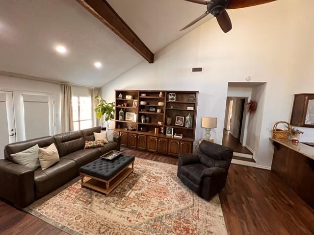 living room with ceiling fan, high vaulted ceiling, wood finished floors, and beam ceiling