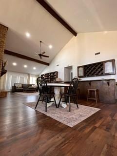 dining room with high vaulted ceiling, beamed ceiling, wood finished floors, and a ceiling fan