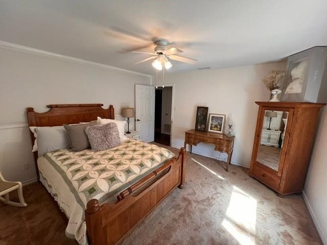 bedroom featuring light colored carpet, ceiling fan, and baseboards