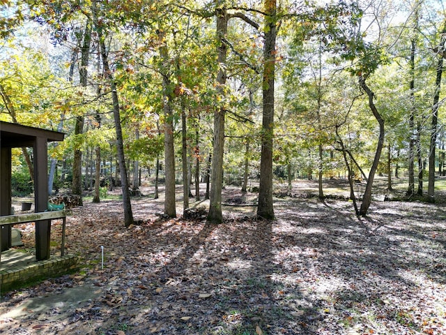 exterior space with a forest view