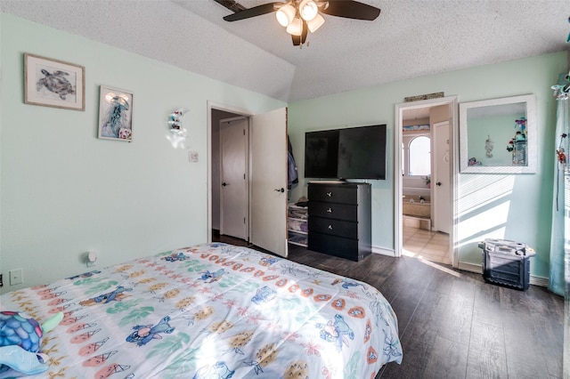 bedroom featuring lofted ceiling, ceiling fan, a textured ceiling, and wood finished floors