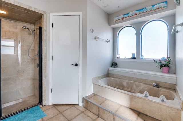 full bathroom with a stall shower, a bath, and tile patterned floors