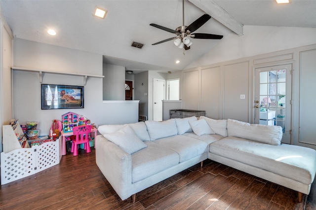 living room with vaulted ceiling with beams, visible vents, a decorative wall, and wood finished floors