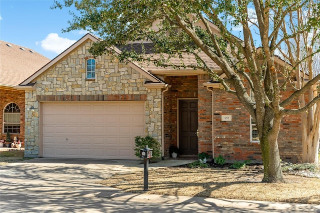 view of front of house with driveway, a shingled roof, an attached garage, and brick siding